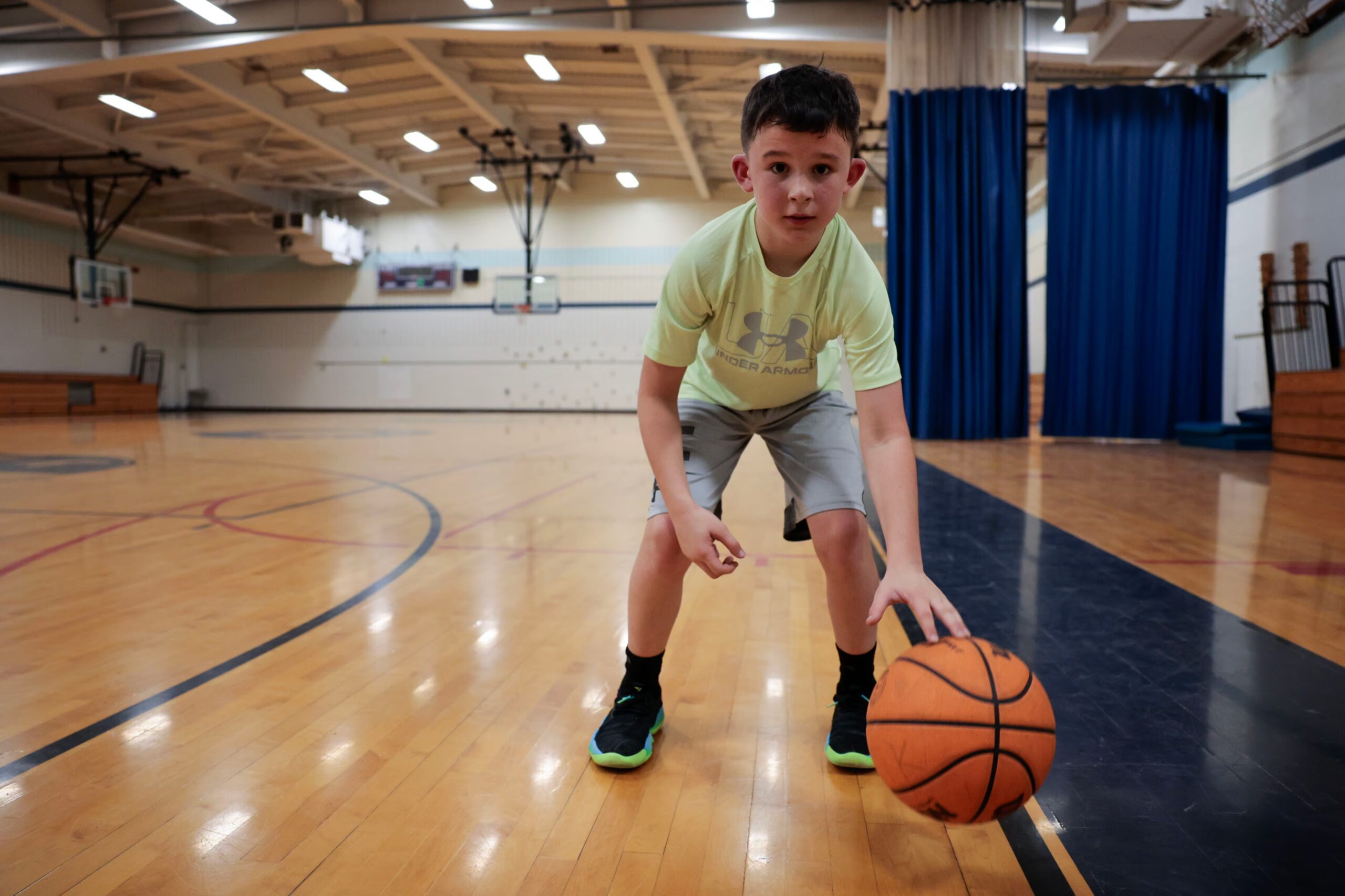 Charlie showed off his dribbling skills following an after-school basketball program at John F. Kennedy Middle School in Florence. 